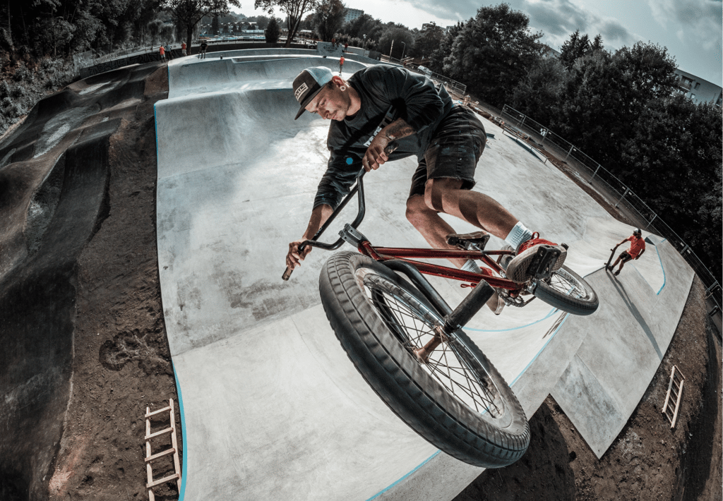 a man riding a bike on a ramp