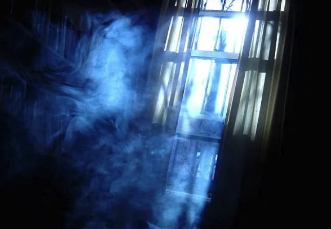a person standing in front of a window with a window