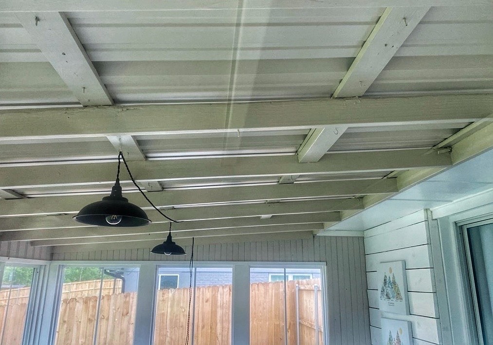 Back porch repair in Tyler, TX after storm caused a tree to fall on roof and porch