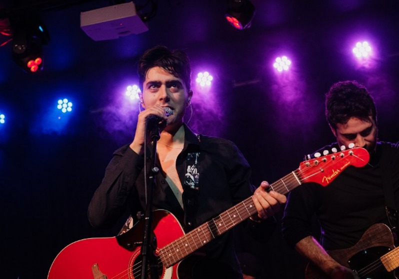 Brighton rock singer Olly Williams performing live with band