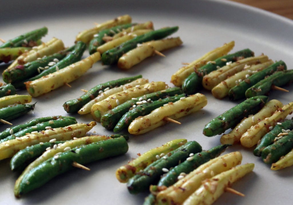 a plate of grilled yellow and green beans