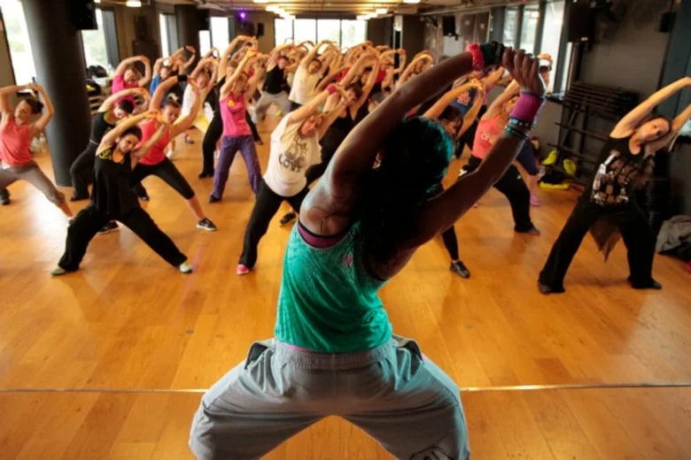 zumba lesson, a group of women combining dance and exercise