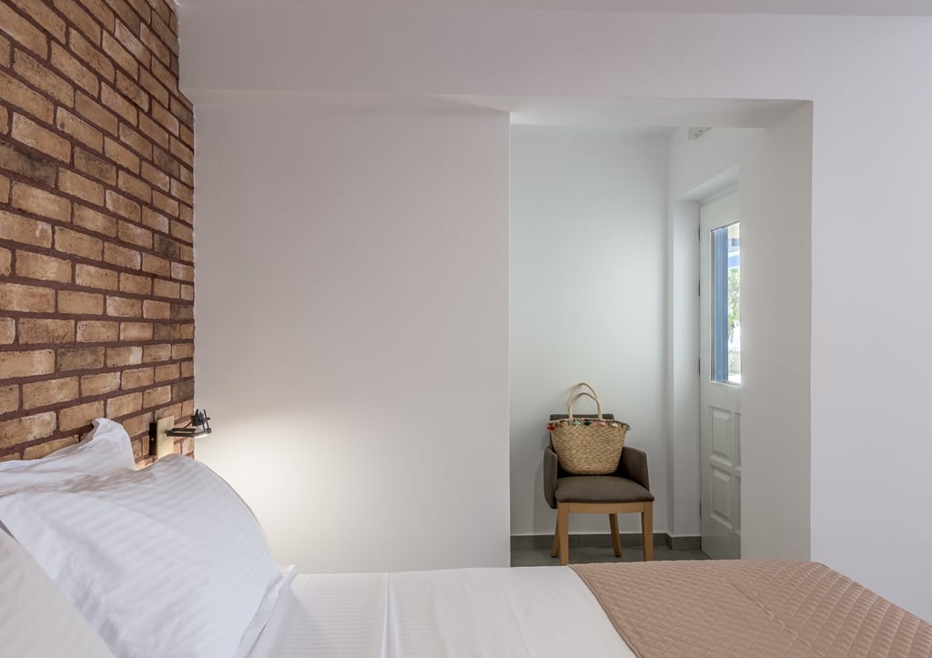 a bedroom with a bed and a chair