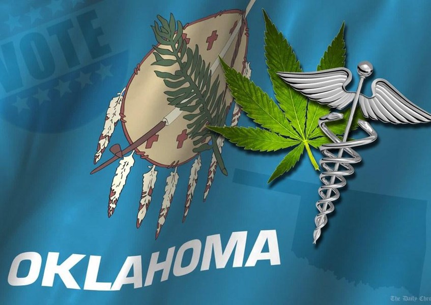 Oklahoma state flag featuring a green marijuana leaf and a silver medical caduceus symbol.