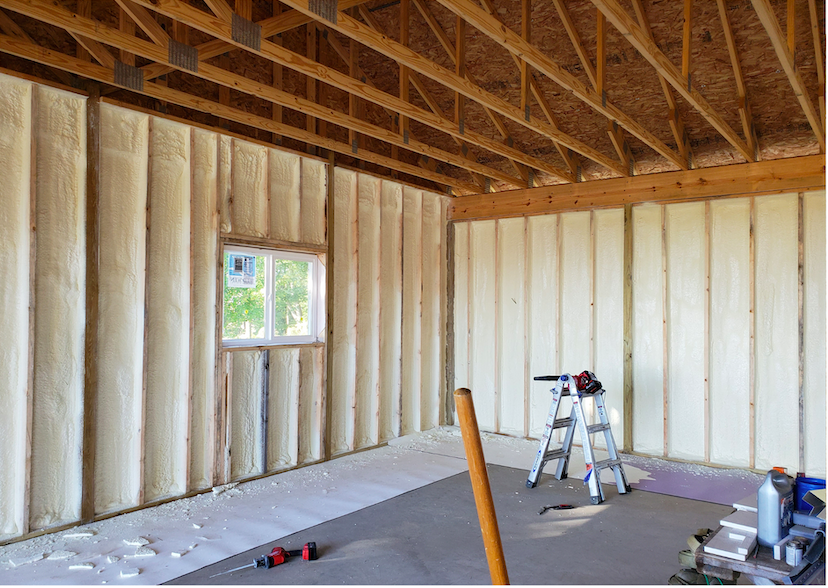spray foam insulation inside of a house in lakewood, colorado