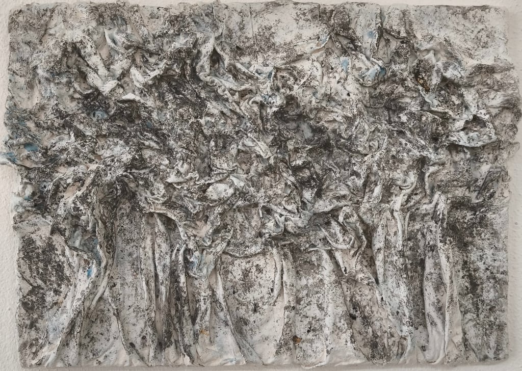 a painting of a group of trees in a white wall