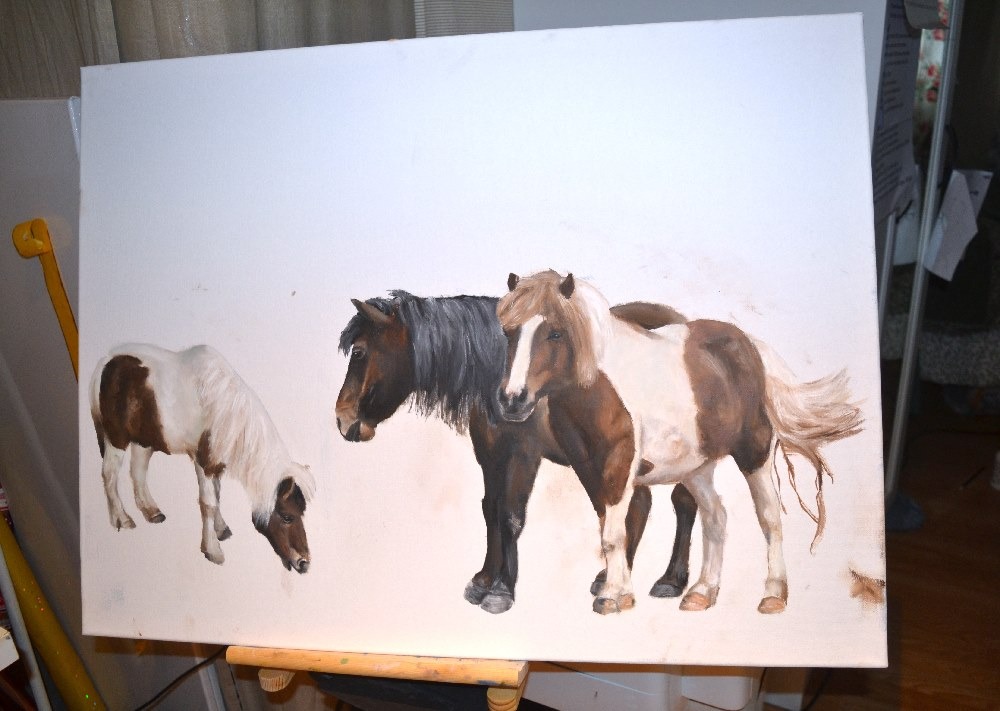 a painting of three ponies drawn on a canvas
