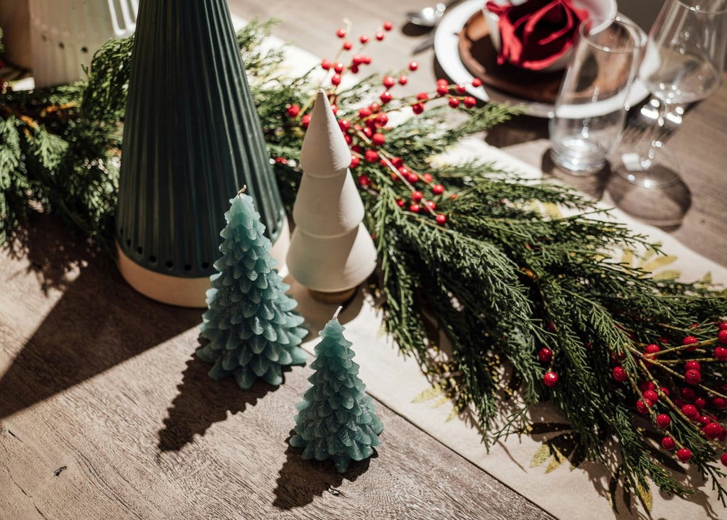 a table with christmas decorations and candles