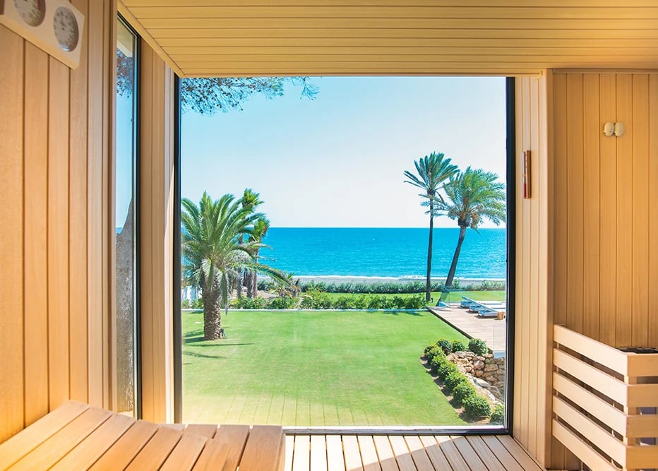 Sauna interior with garden and ocean views