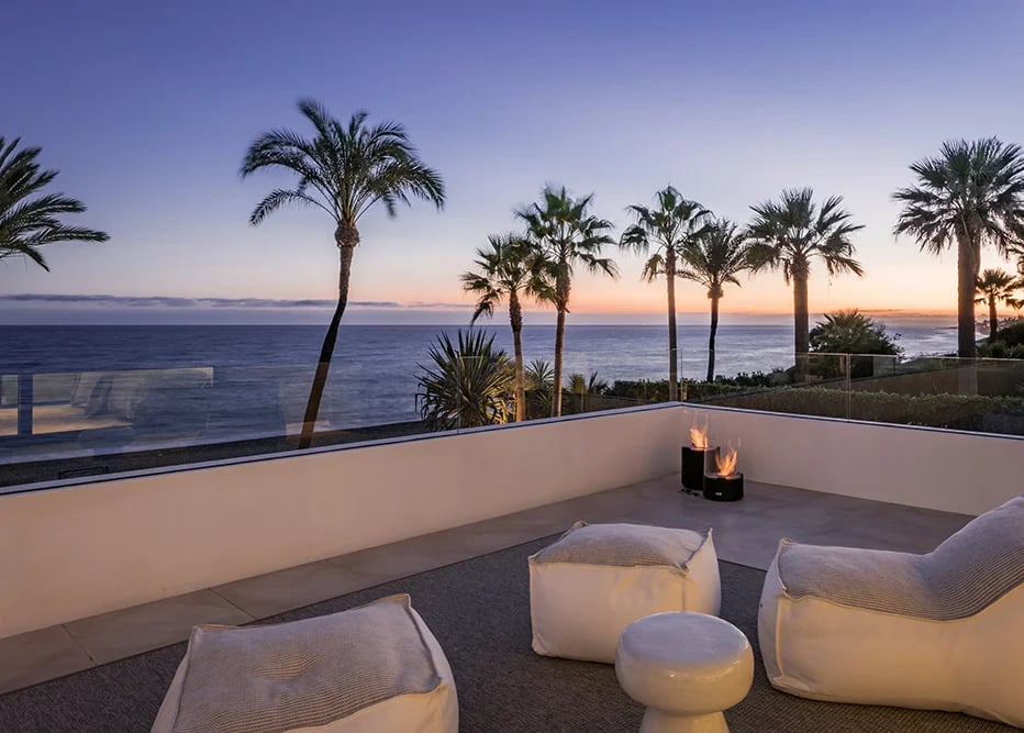 Rooftop terrace lounge with fire features and sunset views