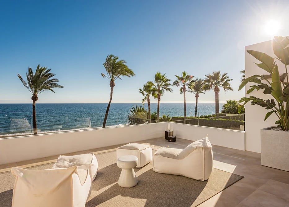 Upper terrace lounge with panoramic beachfront views