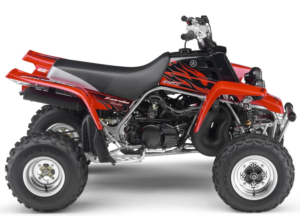Red Yamaha Banshee 350 twin 2-stroke sport ATV with flame decals on a white background.