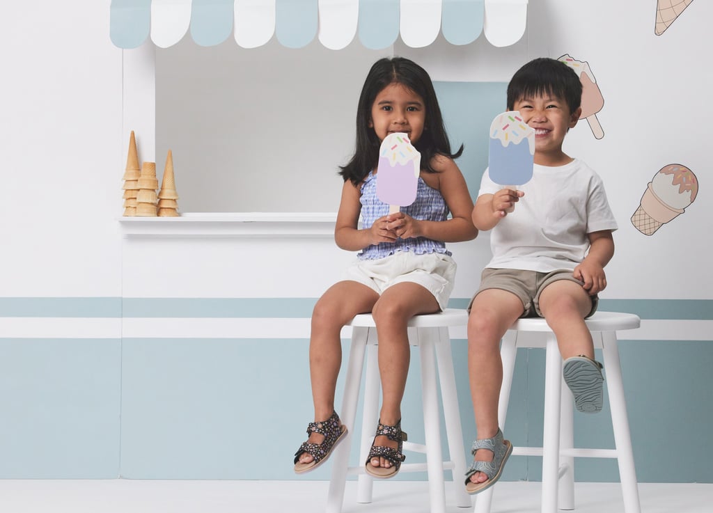 Fashion campaign photography - two children sitting on a stool in front of a ice cream cone