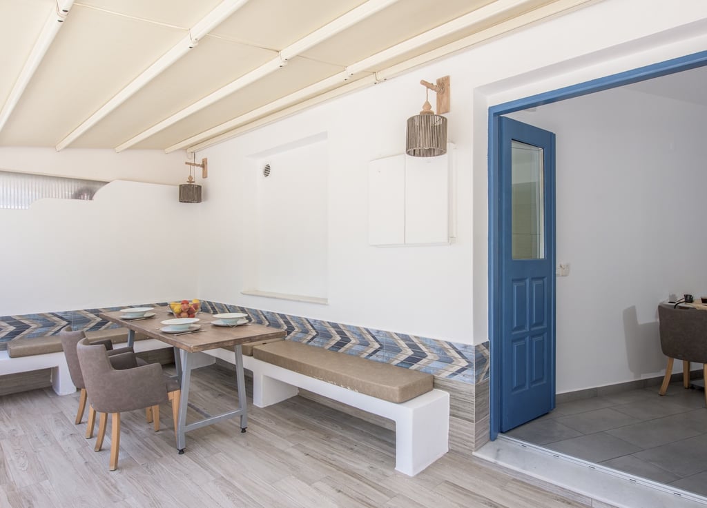 a dining room with a table and chairs