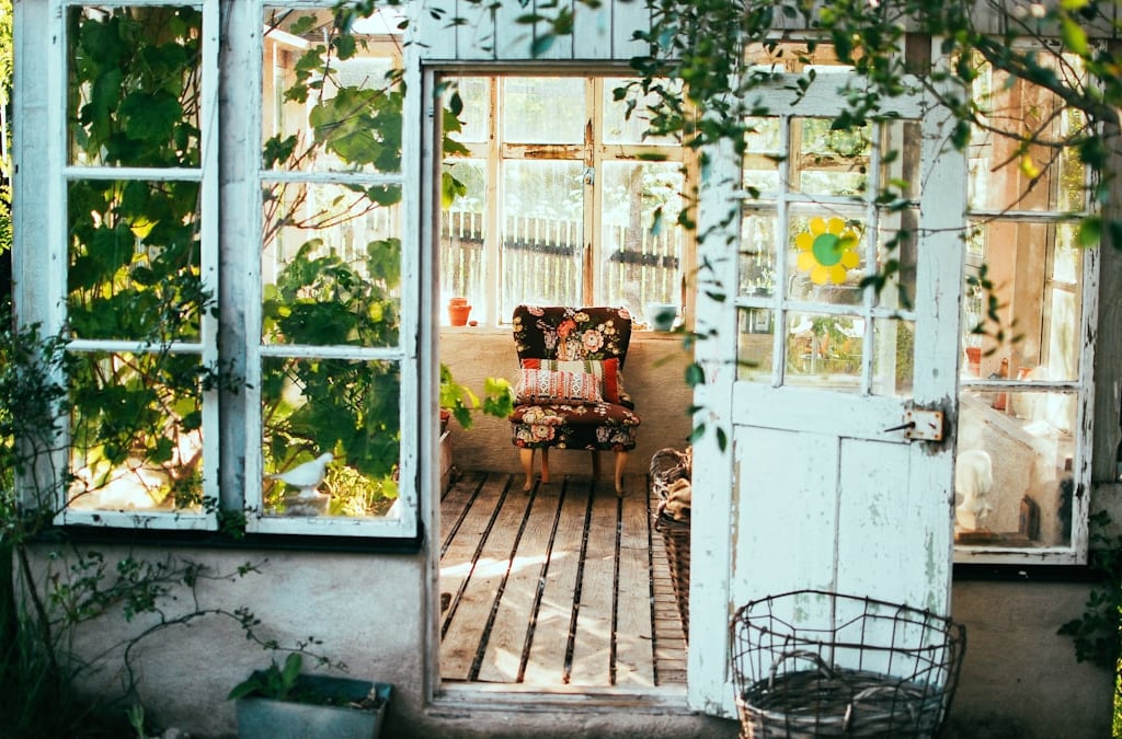 a door way with a chair and a table