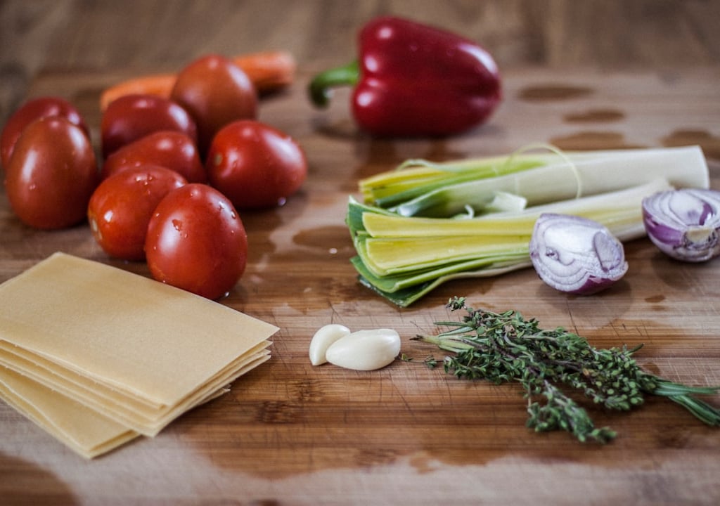 a bunch of vegetables and vegetables on a cutting board