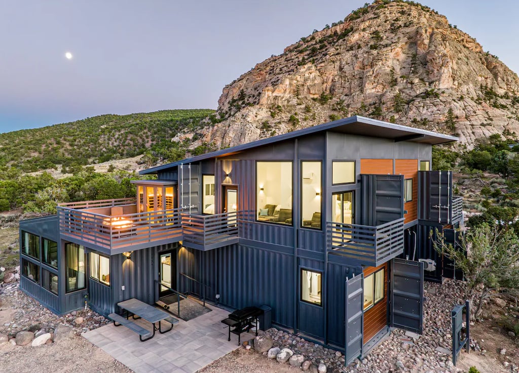 a container house with a mountain view of a mountain