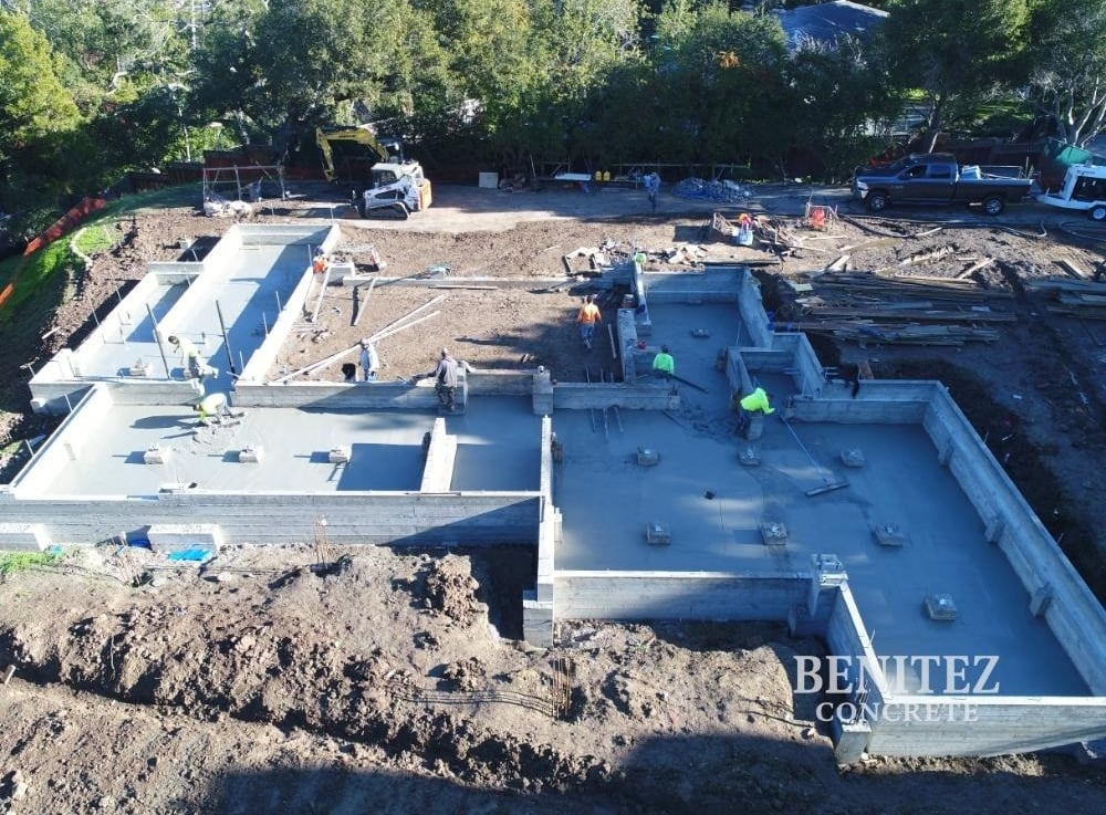 Crew working on large residential concrete foundation
