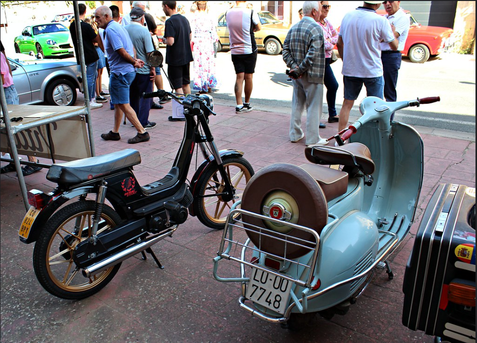 a scooter parked on the side of a street