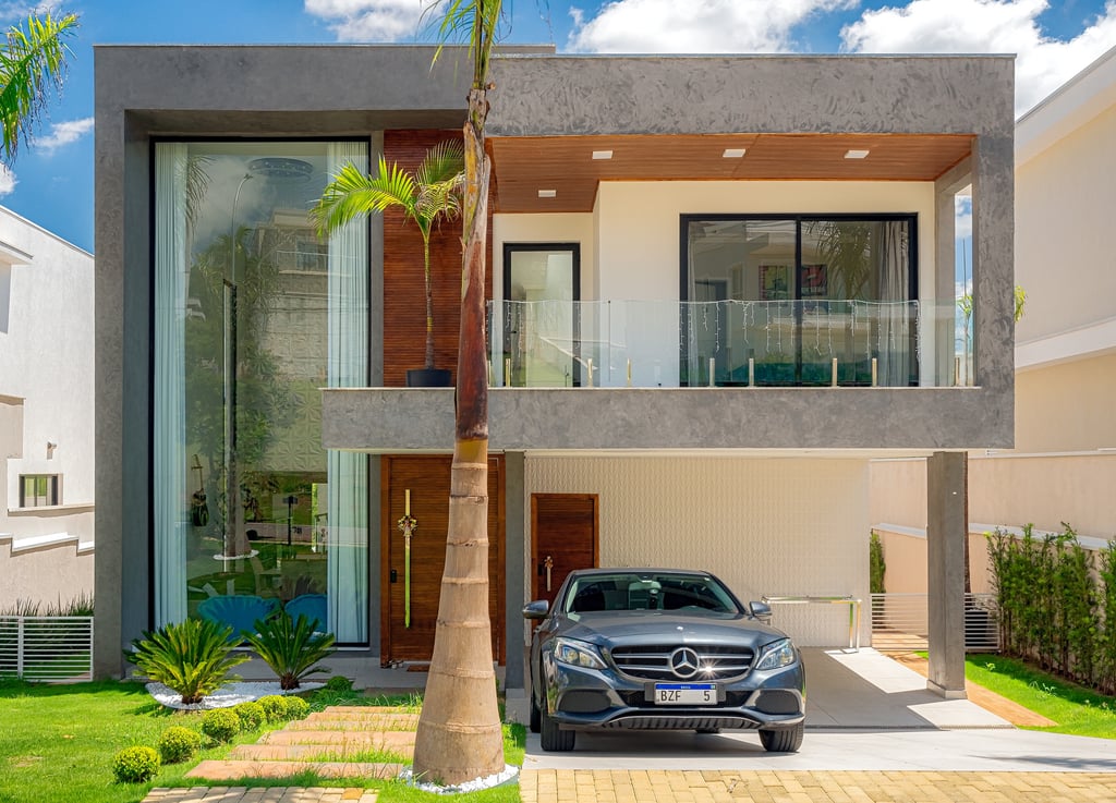 casa contemporânea imponente garragem com mercedez benz e detalhes em concreto aparente