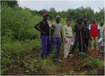 a group of people standing in a field