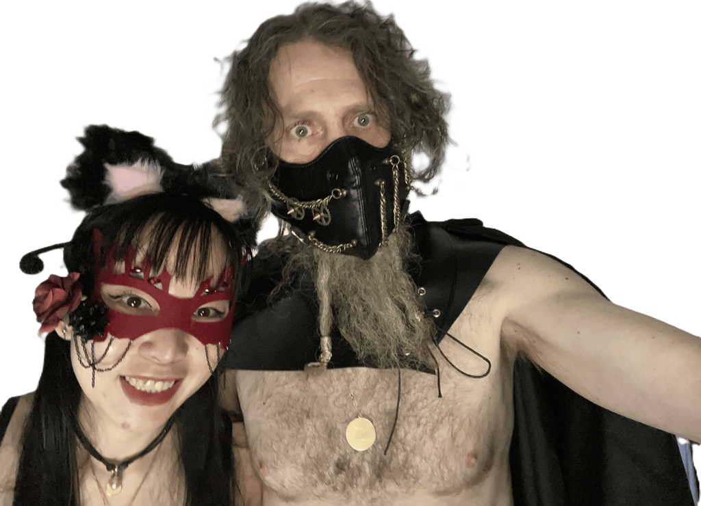 an interracial couple in cosplay facing the camera