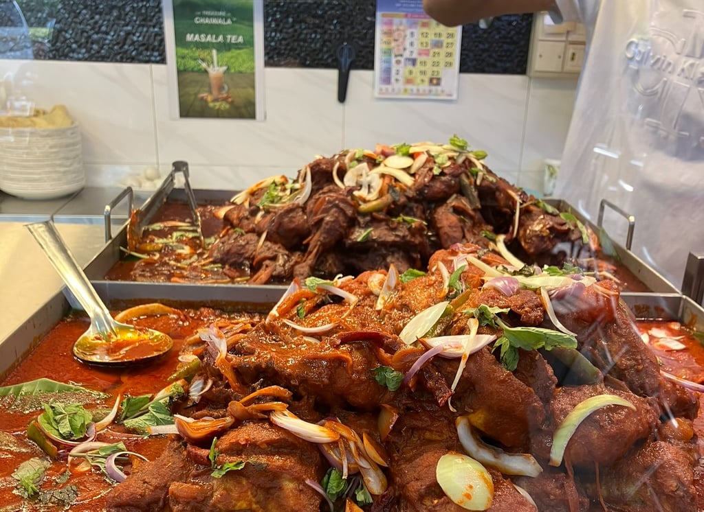 Stacks of curried chicken at Nasi Kandar in Malaysia 