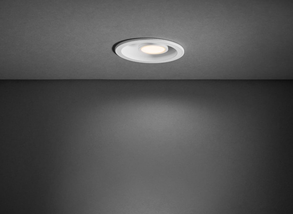 a bathroom light fixture with a recessed ceiling light