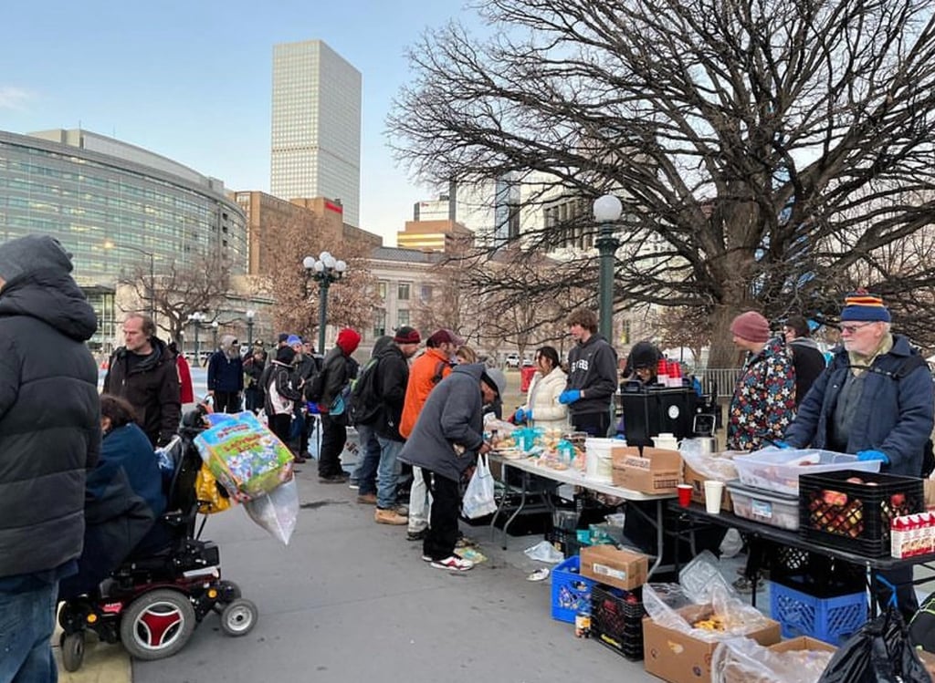 Mutual Aid Monday volunteers handing out food and supplies.