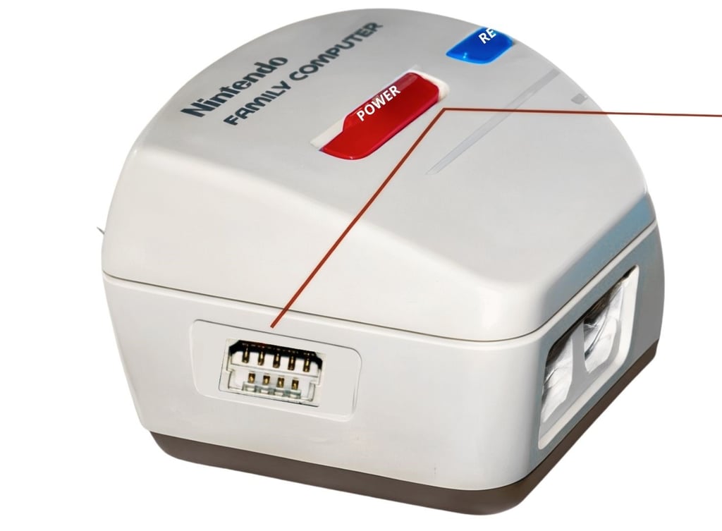 Porta de Expansão (Expansion Port) conector ao lado esquerdo do "console"