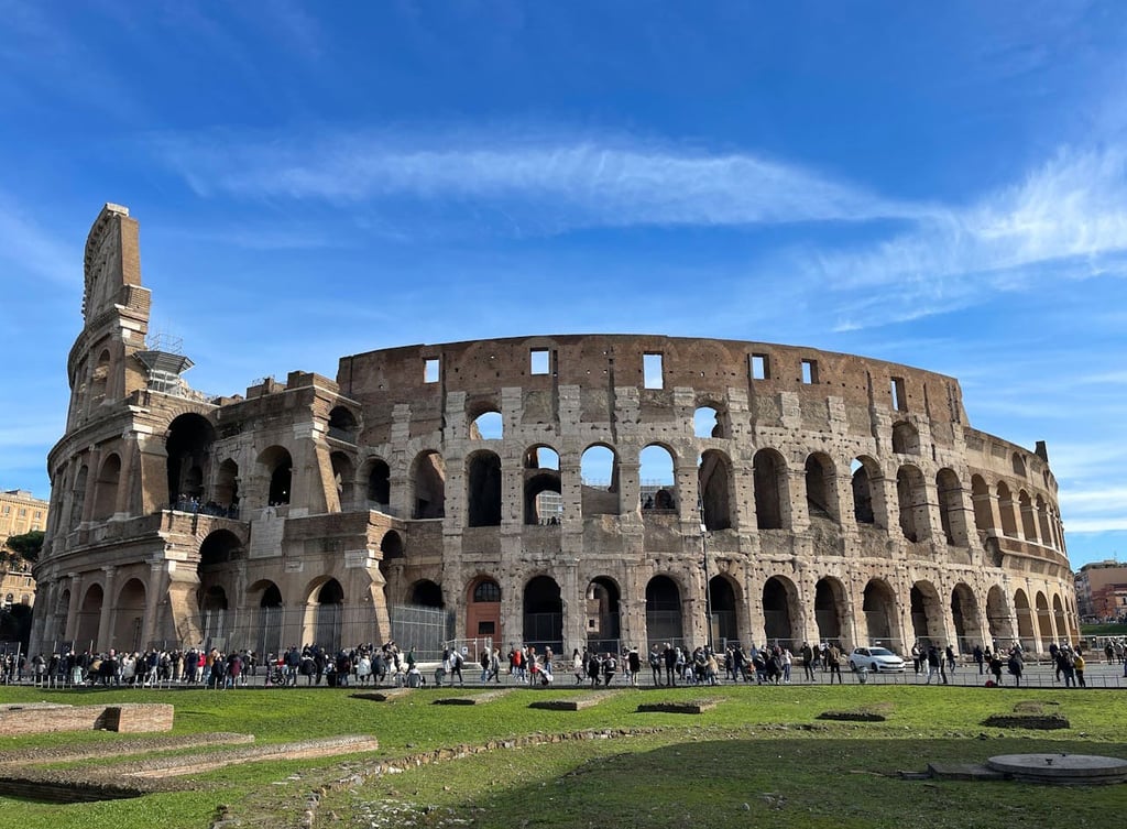 Tourists visiting the Colosseum in Rome, Italy