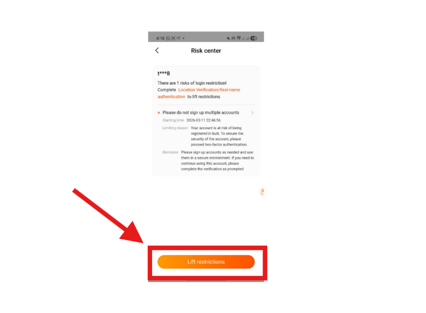 A mobile risk center notification with a red arrow pointing to the lift restrictions button