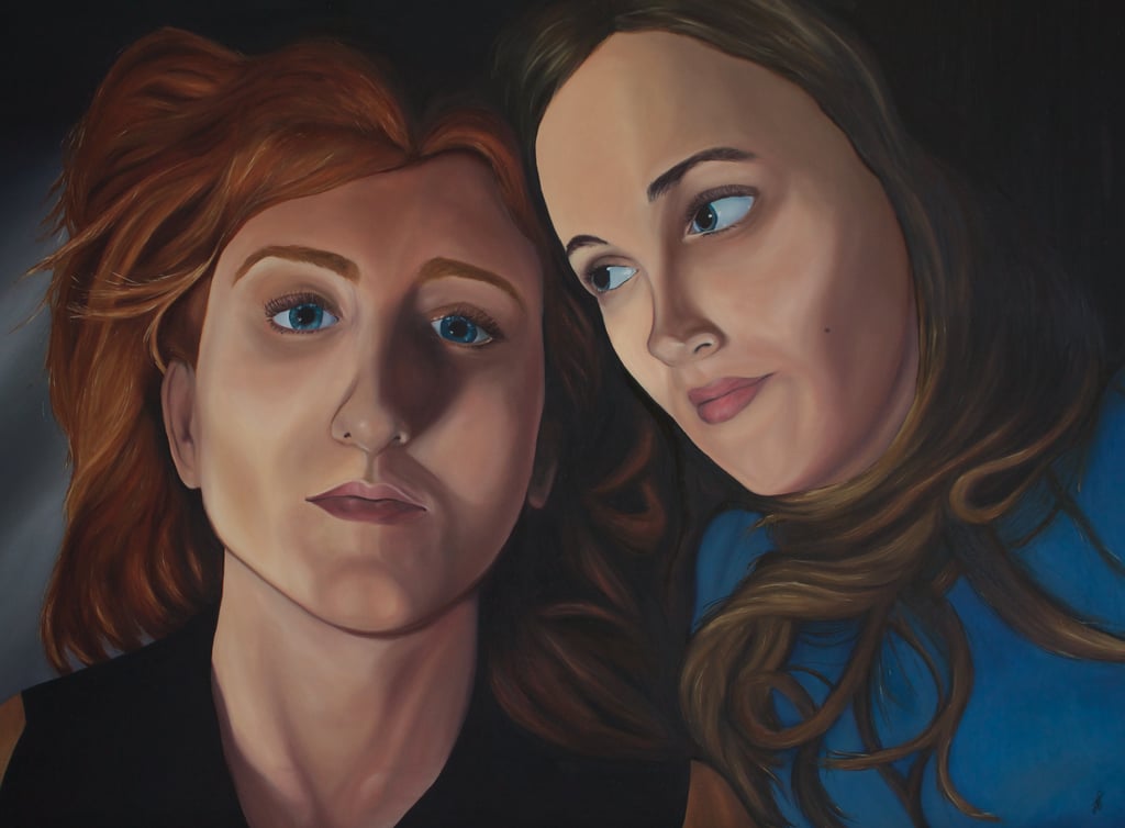 oil painting of two women's faces'