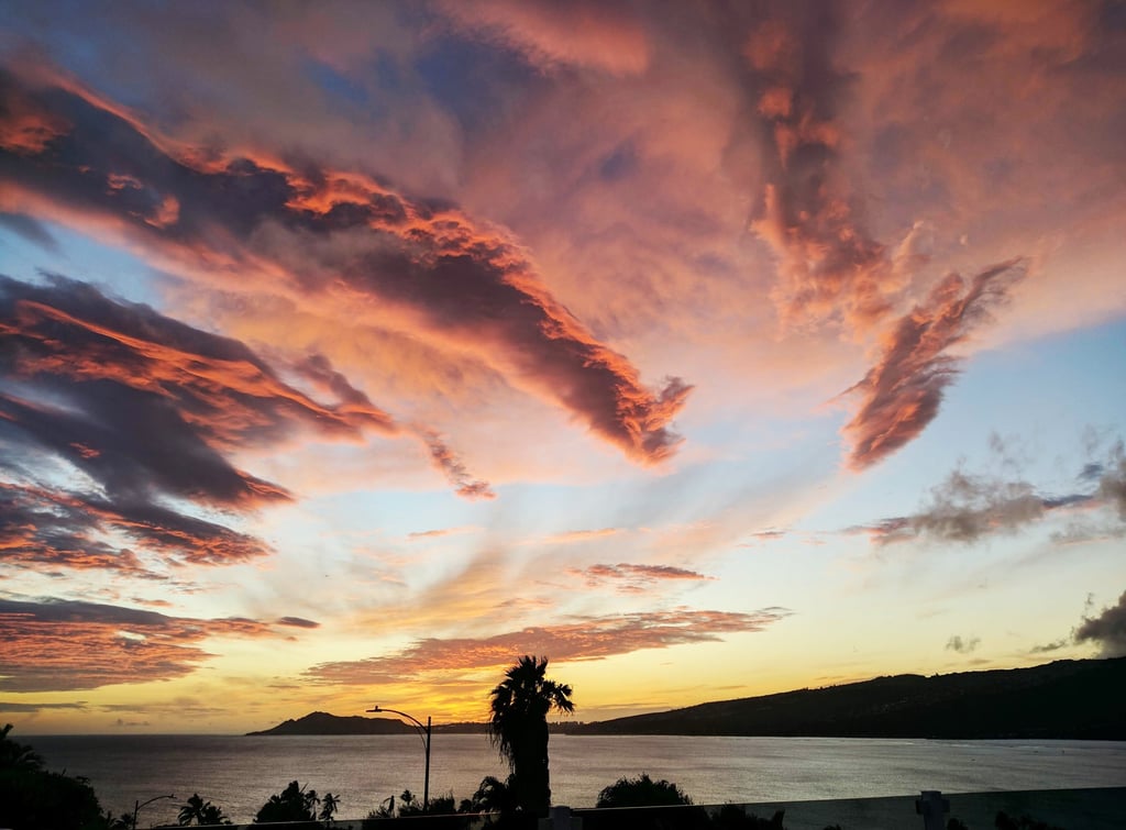 Photo of clouds resembling dragons at sunset