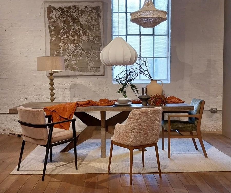 a dining room with a table and chairs