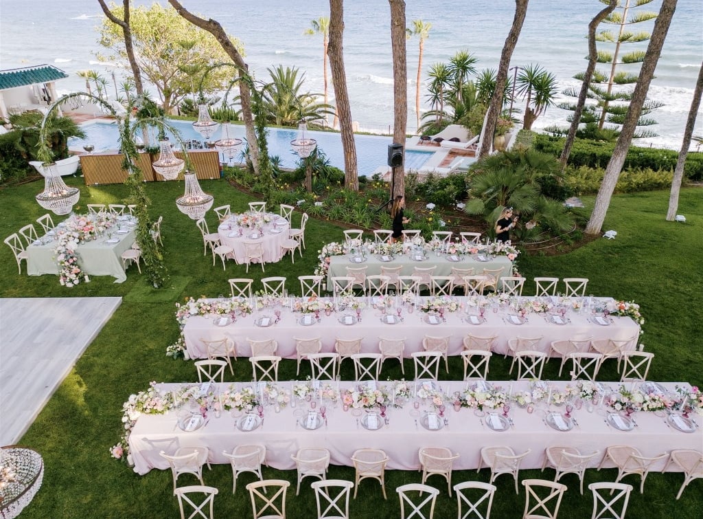 Aerial view of luxury destination wedding setup by the sea at Villa El Rincon Marbella