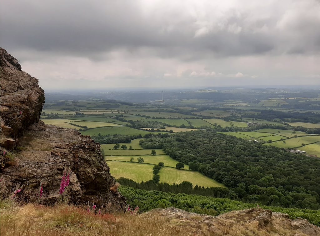 Panoramic view of green English countryside valleys and rolling hills from The Wrekin.