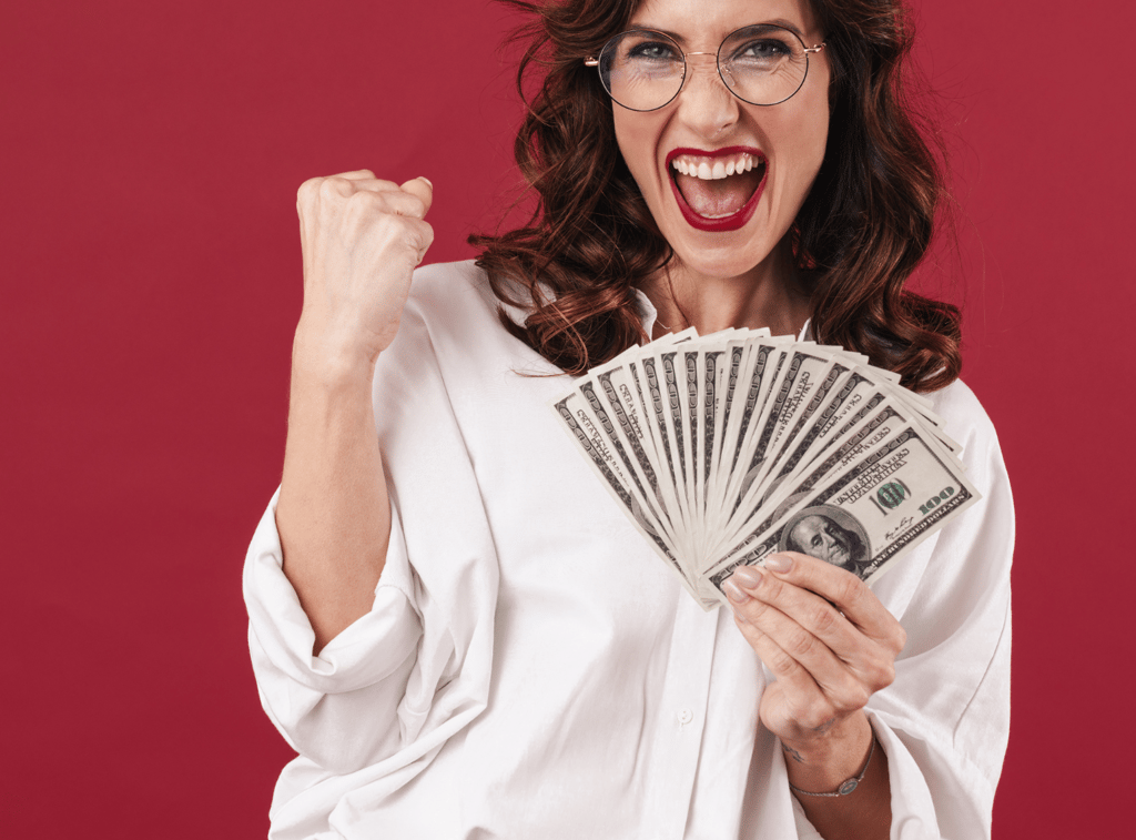 a woman with glasses and a white shirt holding a stack of money