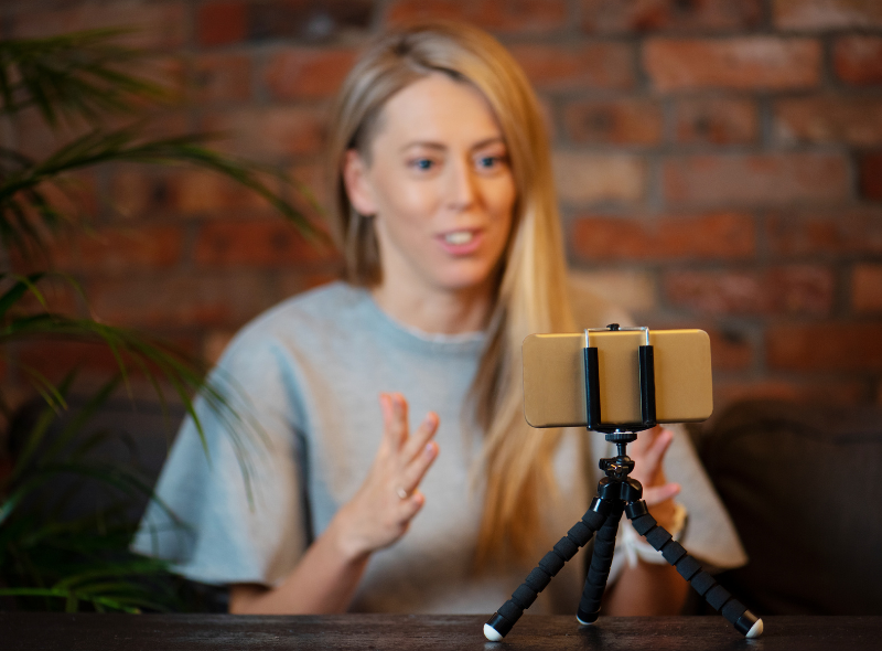 Realtor creating video content for social media to engage buyers and sellers online.