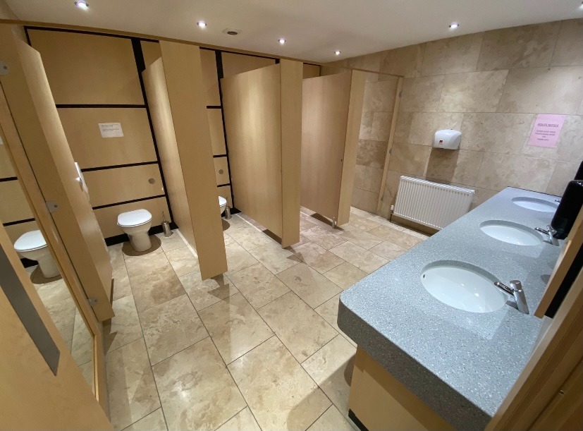 Premium beauty room amenities in Shirley Solihull including couch and entertainment screen.