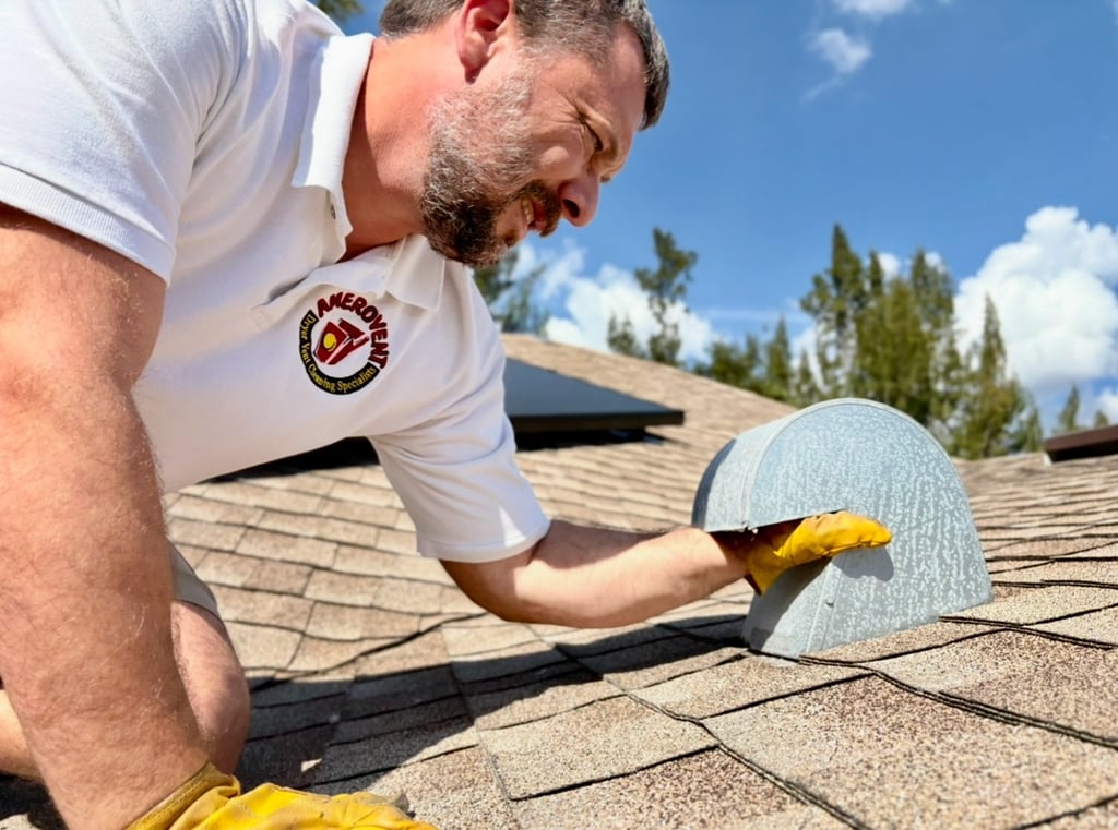 Andrew cleaning the dryer vent on the roof