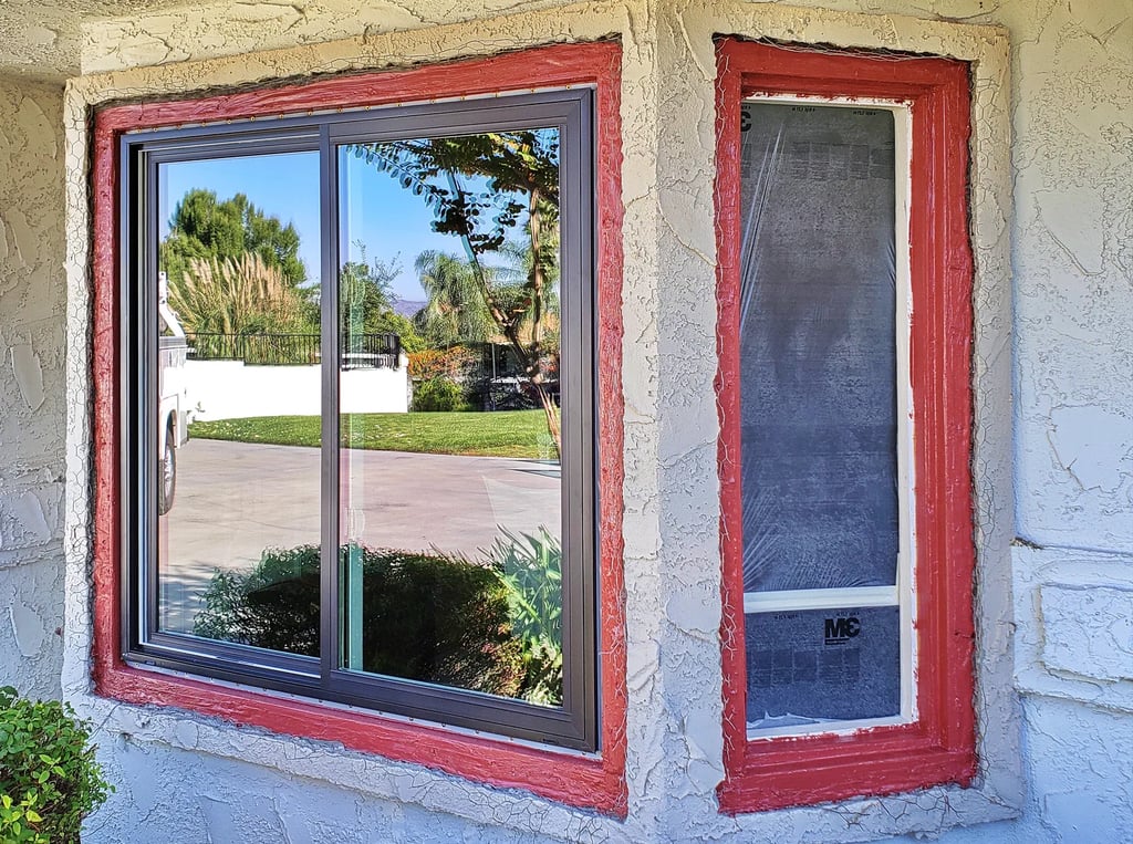 Andersen 100 series Fibrex windows with Prosoco Fast Flash waterproofing by SAE Builders.