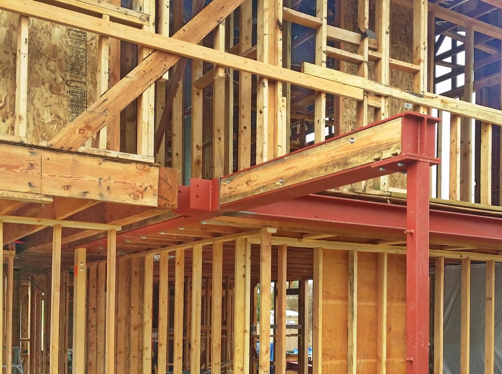 Structural steel framing in residential remodel by SAE Builders.