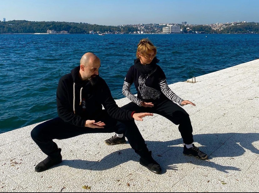 Ismet Himmet and Mine Şilliler practicing Tai Ji stances on the Bosphorus shore in Istanbul.