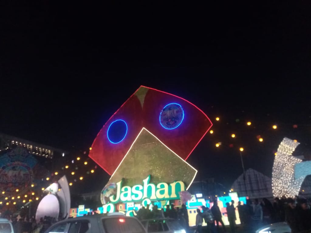 Basant 2026 decorations in Lahore featuring a large decorative kite displayed on the road.” ‎