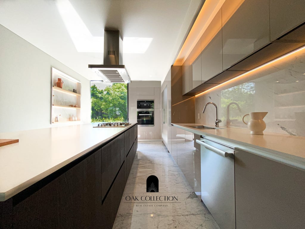 a kitchen with a long counter top and a large window