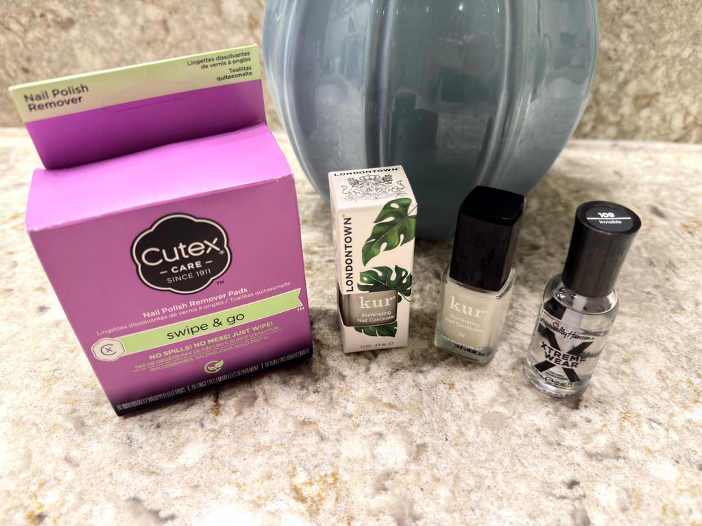 Londontown nail concealer with Cutex remover pads and Sally Hansen top coat for easy nail care.