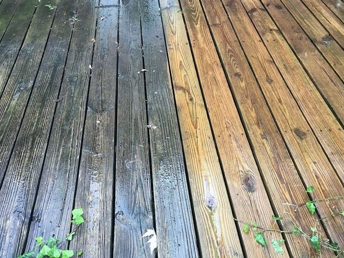 A wooden deck cleaned 50/50 to show the difference