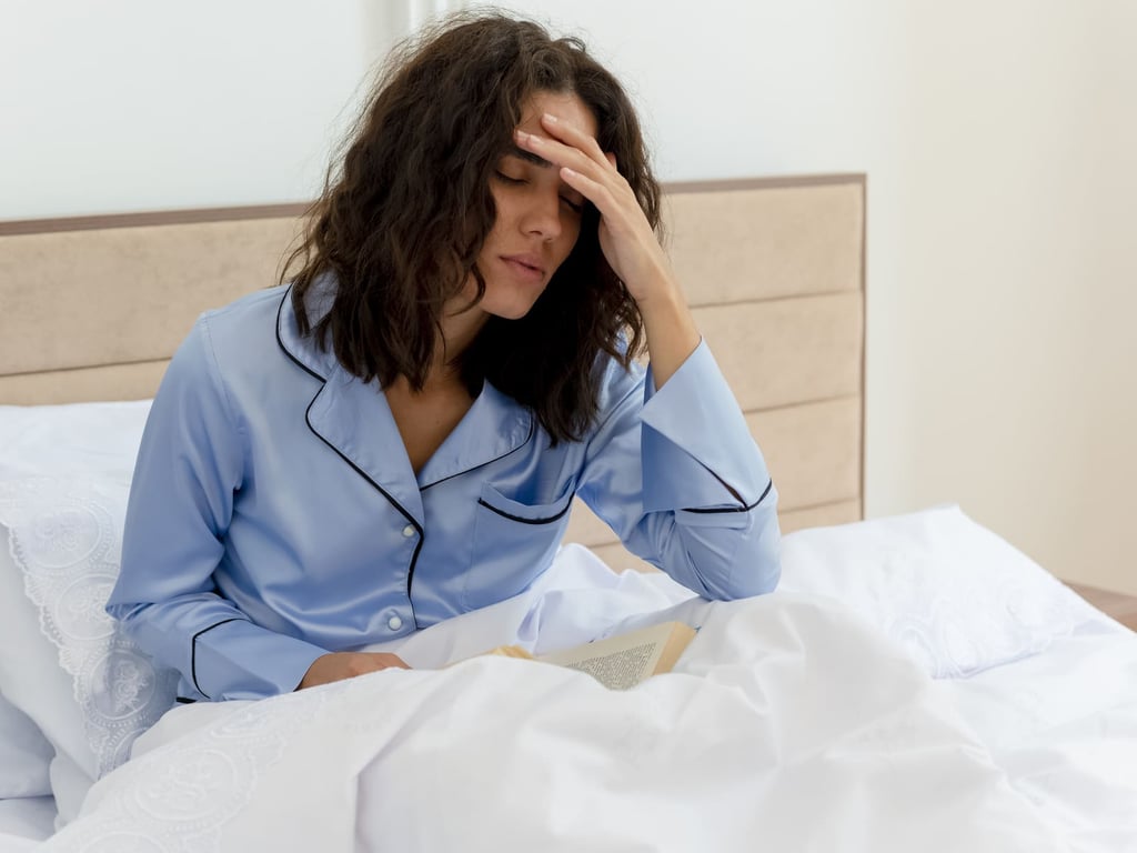 Woman waking up tired due to sleep apnea and poor sleep quality