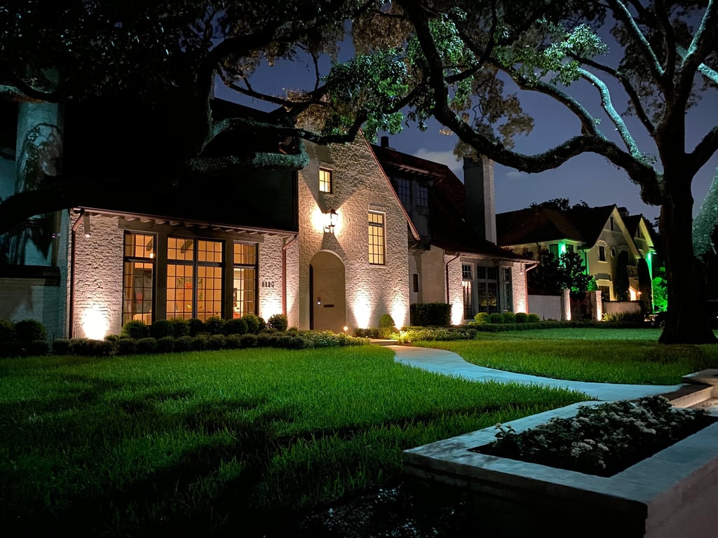 landscape lighting on front facade of house, tree up lighting and moon lighting